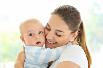 Mother and baby on light background
