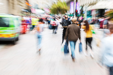 crowd of people crossing a street with zoom effect