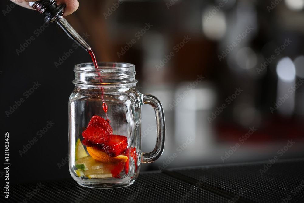 Poster woman hands making cocktail on bar counter