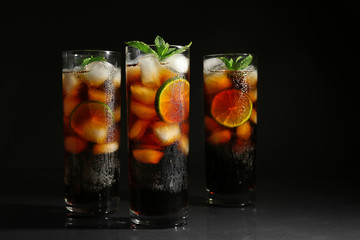 Cuba libre cocktails on dark background