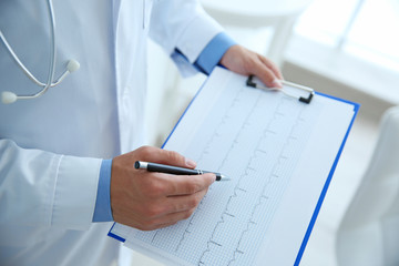 Male doctor at work in clinic office