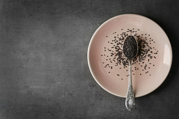 Black sesame in spoon, top view