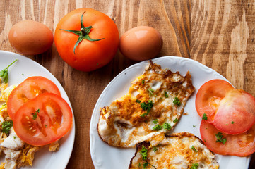 Scrambled, fried, boiled eggs on a wooden table