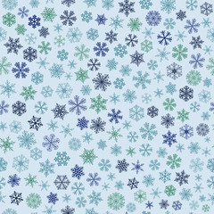 Seamless pattern of snowflakes, blue and green on light blue