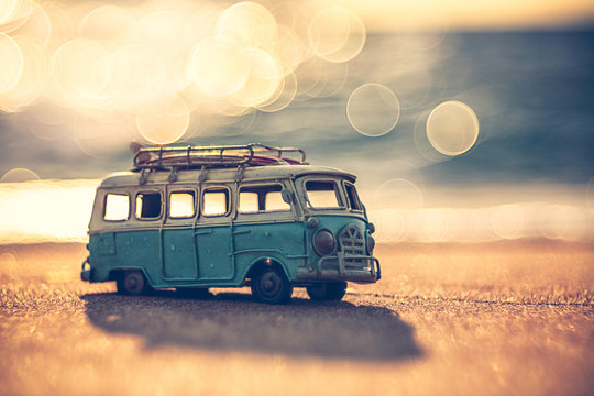 Vintage miniature van in vintage color tone, travel concept
