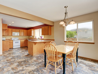 Classic kitchen room interior with tile floor and dining area