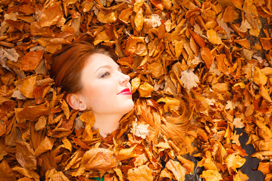 Woman face in autumn scenery