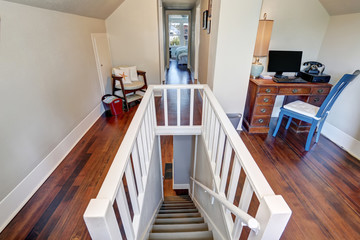 Hallway interior on the second floor. Top view downstairs. Hardwood floor.