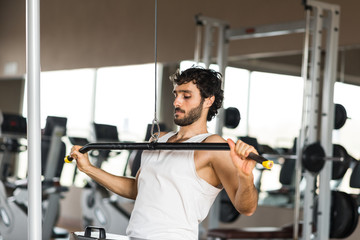 Fototapeta na wymiar Man training in a gym