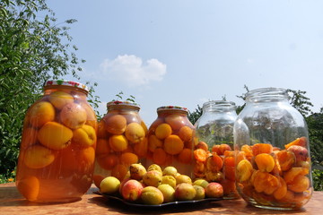 Ripe apricot fruits in glass jars for canning.