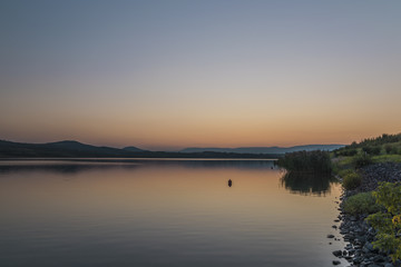 Fototapeta na wymiar Sunset near Milada lake in summer evening