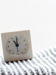 Series of a simple white analog clock on the blanket, 13/15