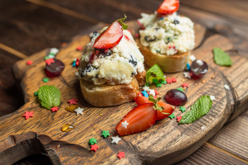 bruschetta with cottage cheese on wooden board