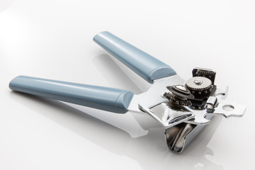 Can opener with blue handle on a white background