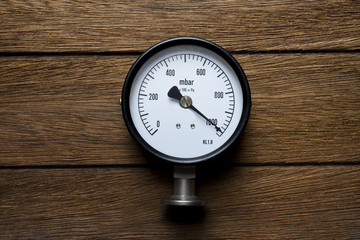 pressure gauge on wood background