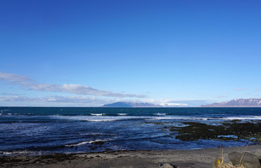 Beautiful coast with snow mountain background at Reykjavik City