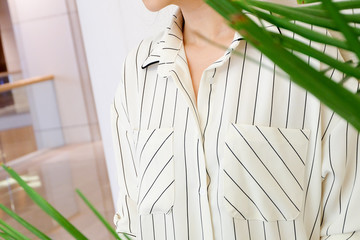 beautiful white striped woman blouse shirt fashion details close up