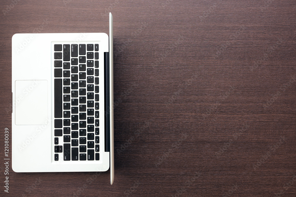 Poster laptop computer with blank space on wood desk top view