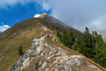 Girl tourist descends the mountainside