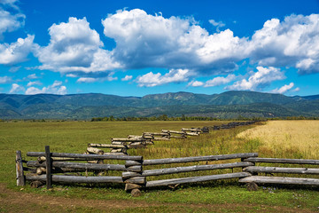 Fototapeta na wymiar Old fence in the fields Tunka Valley