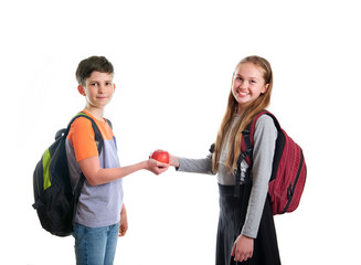 the happy boy offers the girl an Apple