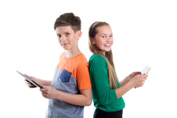 Happy boy and girl are looking at tablet PC's - 121081652