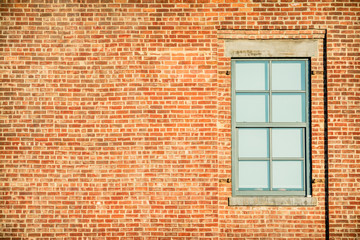 lonely window at brick facade