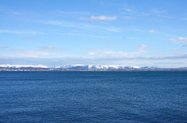 Beautiful coast with snow mountain background at Reykjavik City