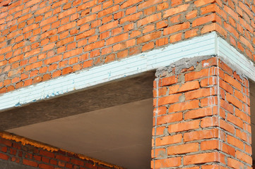 Close up on Thermal Bridge and Facade Wall Insulation. A thermal bridge, also called a cold bridge or heat bridge in brick house wall insulation for house energy saving outdoor