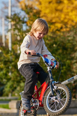 Fototapeta na wymiar Little boy on bike