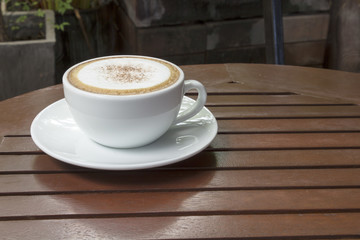 hot coffee on wood table