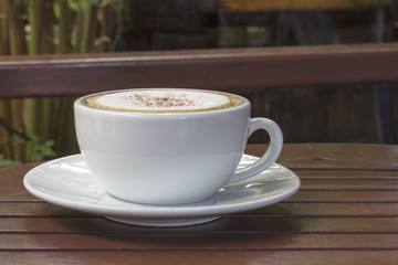 hot coffee on wood table