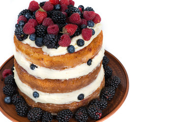 Tasty cake with strawberry, raspberry and blackberry isolated on white