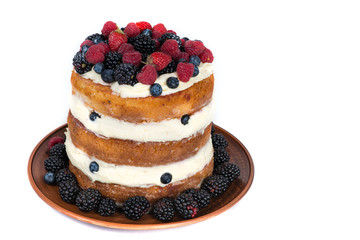 Tasty cake with strawberry, raspberry and blackberry isolated on white