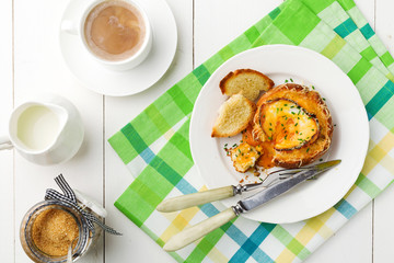 Baked sandwich with egg, cheese and ham.