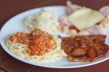 Chicken spaghetti with pork steak