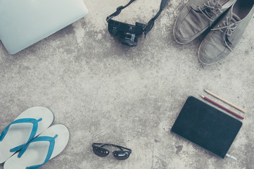 Mock up with necessary equipment for travel on cement background