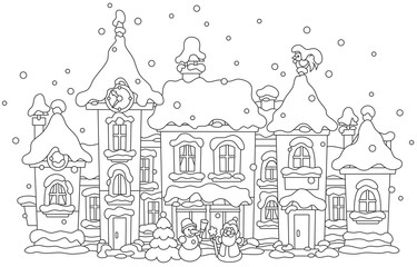 toy houses covered with snow on Christmas