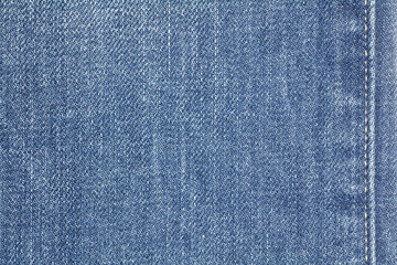 Naklejka premium Denim jeans texture or denim jeans background with seam. Old grunge vintage denim jeans. Stitched texture denim jeans background of jeans fashion design.