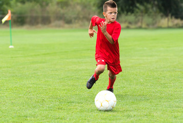 Boy Shooting at Goal