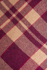 warm blanket. The pattern strips intersect. Maroon stripes. The texture of the blanket. Background