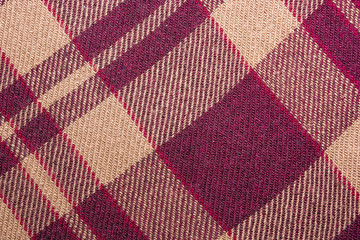 warm blanket. The pattern strips intersect. Maroon stripes. The texture of the blanket. Background