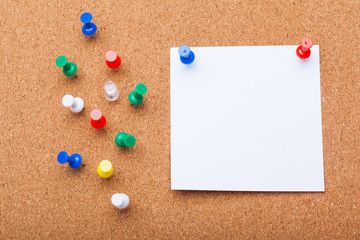 blank note paper on a cork board