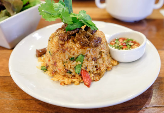 fried rice spicy tom yum sweet pork and chili with vegetable on