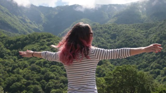 Young Beautiful Girl Standing On A Mountain Hands Raised Desire To Fly HD