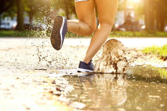 Splash In Mud Puddle By Runner