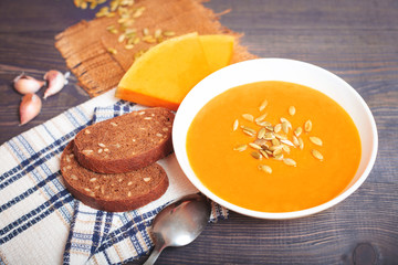 Pumpkin soup on a wooden table