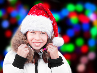 Child wearing Santa Claus Christmas hat