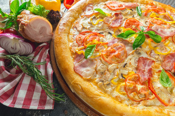 Pizza with dry cured ham and basil
