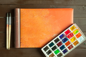 Fototapeta premium Set of watercolor paints and paintbrushes for painting